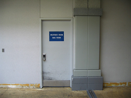 [door with sign: "Weather Room, Bag Room"]