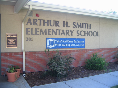 [sign: "Arthur H. Smith Elementary School" - "This school reads to succeed!  2001 reading goal achieved!"